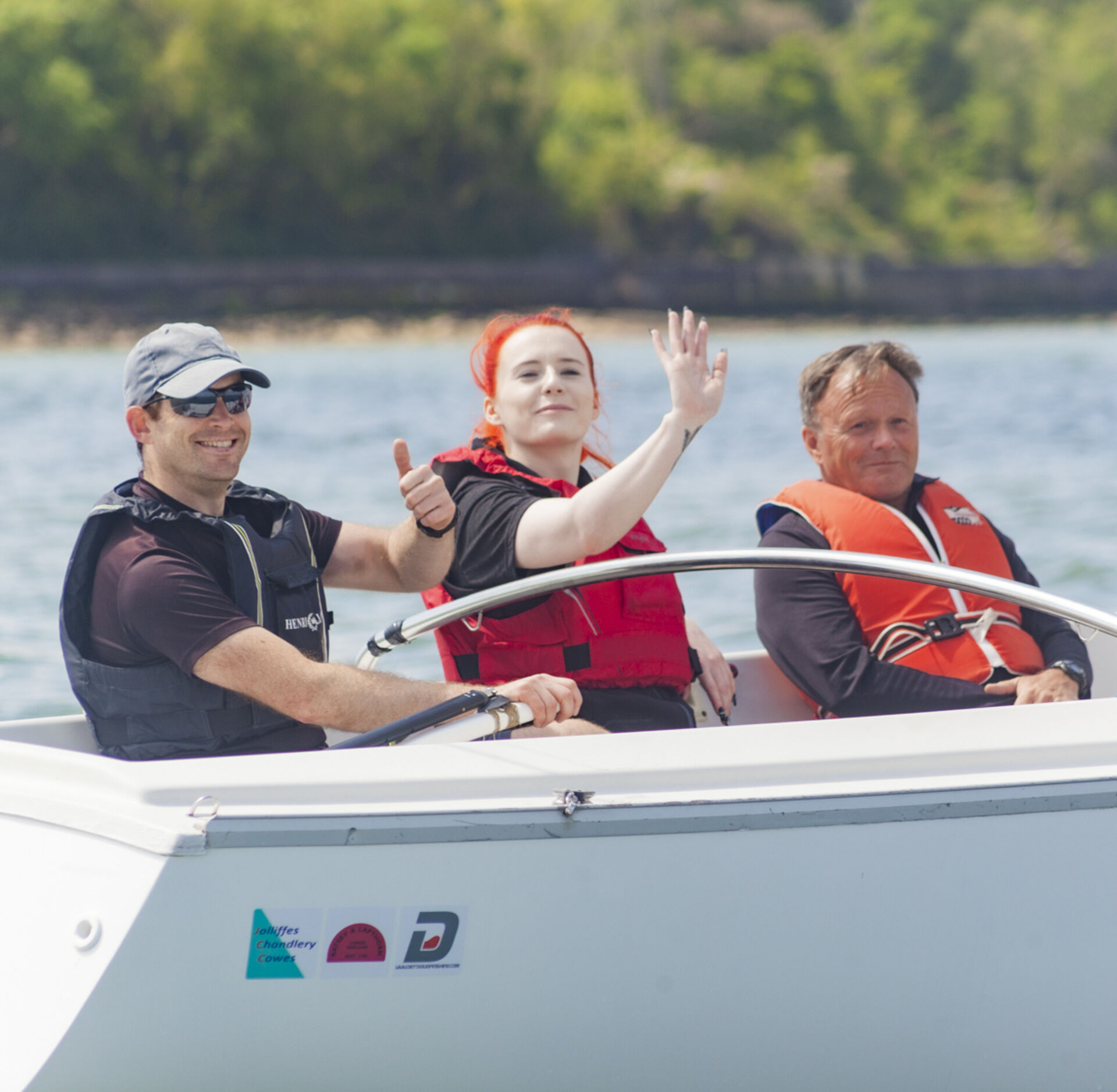 From left to right: Chief of Design, Jon, Chief of Personnel, Sophie, and Mark Commodore of Cowes Corinthian Yacht Club & Trustee of The Andrew Cassell Foundation out on the water together.